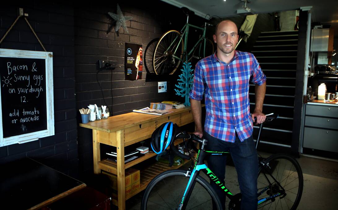 Wollongong cafe owner Mark Pearson supports new cycling laws which he says will help ensure cyclists know the rules and share the road safely. Picture: Sylvia Liber
