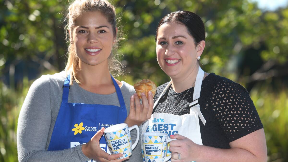 Sharing is caring: Cancer Council NSW Southern Region staff Emma Swords and Caitlyn Zalewski share a cuppa to promote Australia's Biggest Morning Tea. Picture: Robert Peet