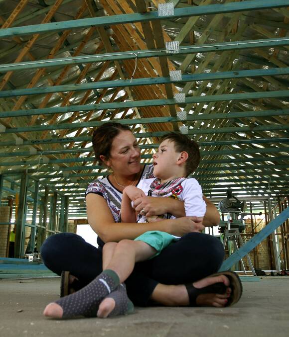 Renovation rescue: Lenice Heffernan with Dexter, 4, at their Kiama Downs home which is being given an overhaul thanks to the generosity of the region's tradies. Picture: Sylvia Liber