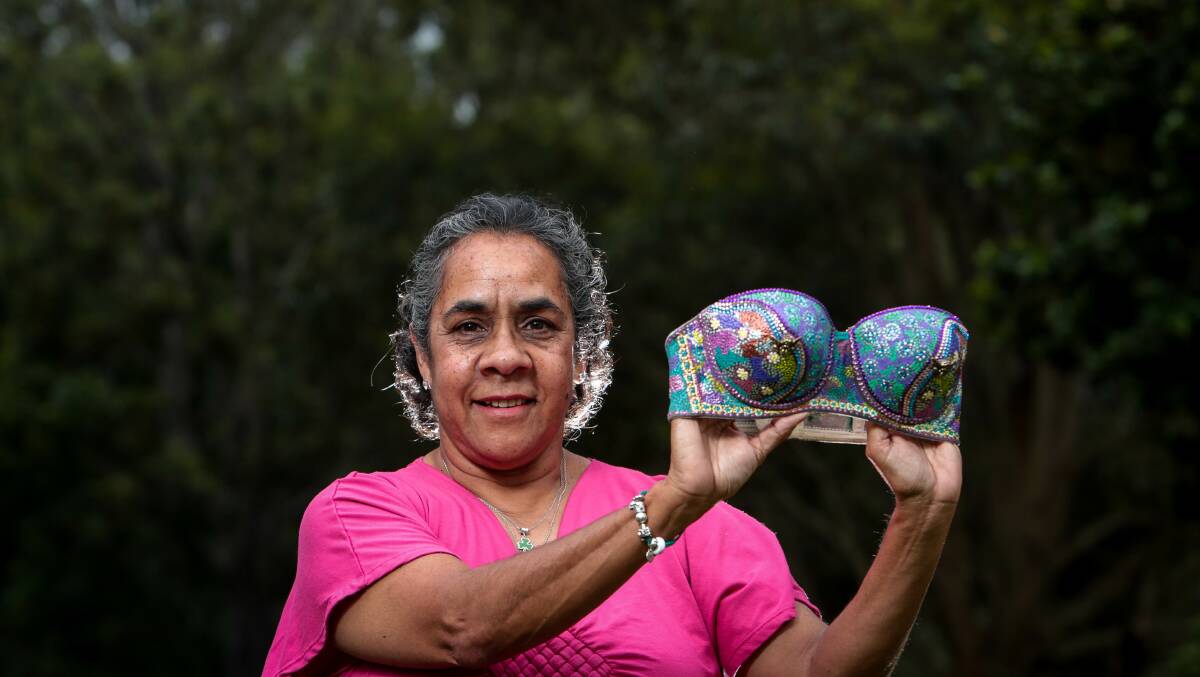 Sister act: Aunty Lindy Lawler with the handpainted bra she has created for this year's Bling a Bra competiton as a tribute to her late sister. Picture: Adam McLean