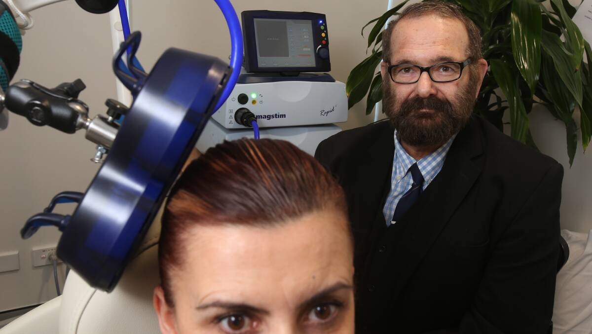 Revolutionary: Dr Irwin Pakula demonstrates the new magnetic therapy available for patients at South Coast Private Hospital. Picture: Robert Peet