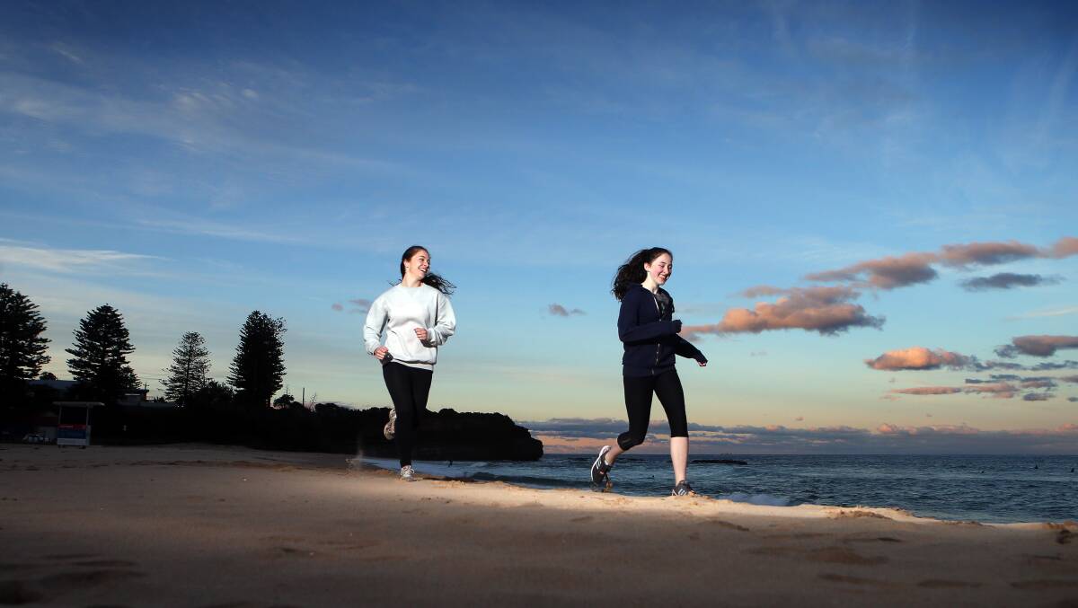 A matter of honour: Austinmer's Georgia and Abby Clunas are gearing up for the 2017 City2Surf to honour their grandfather Barry Clunas. Picture: Sylvia Liber