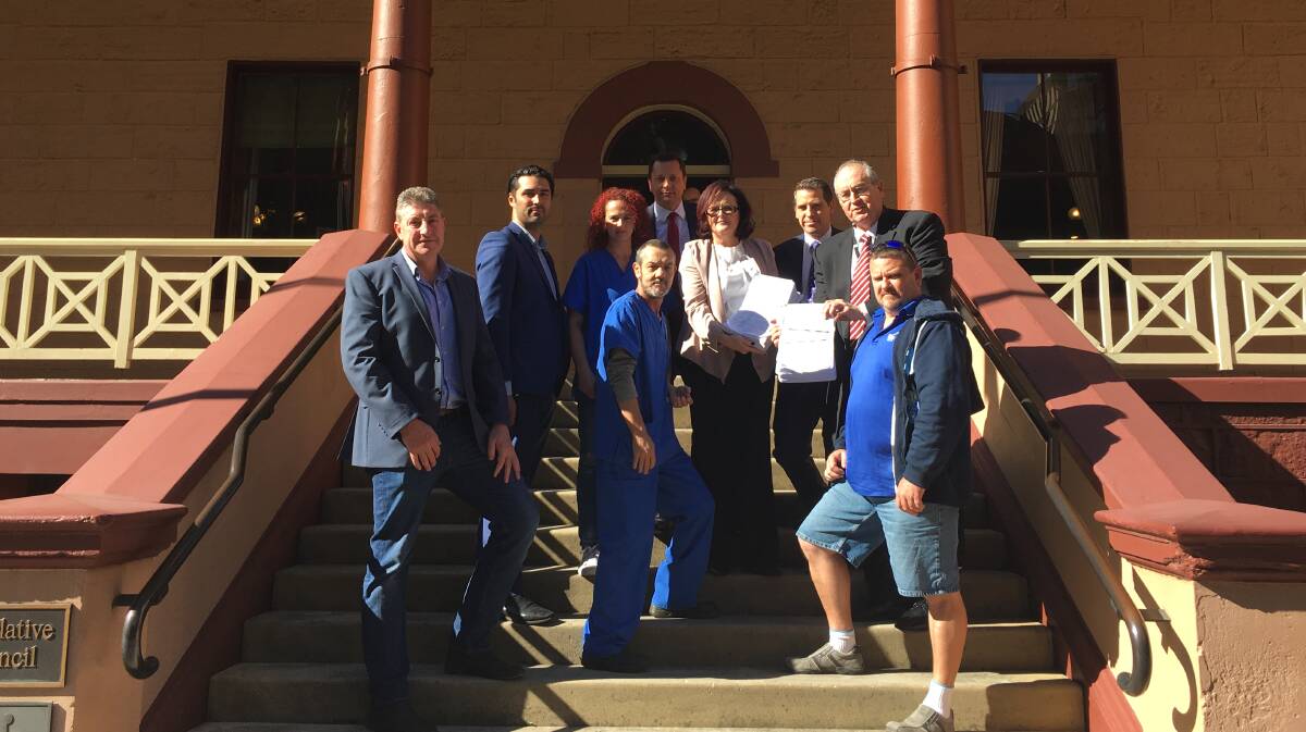 Opposition: Hospital staff union representatives met with Labor MPs at Parliament House to hand over a petition opposing plans for Shellharbour Hospital. Picture: Supplied