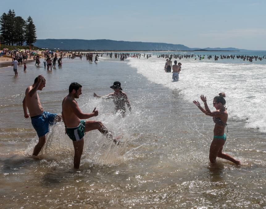 Heat is on: Ryan Hickey, Leonardo Cervice, Madeleine Ryan and Lisa Hickey at North Wollongong beach on Monday. Picture: Adam McLean 
