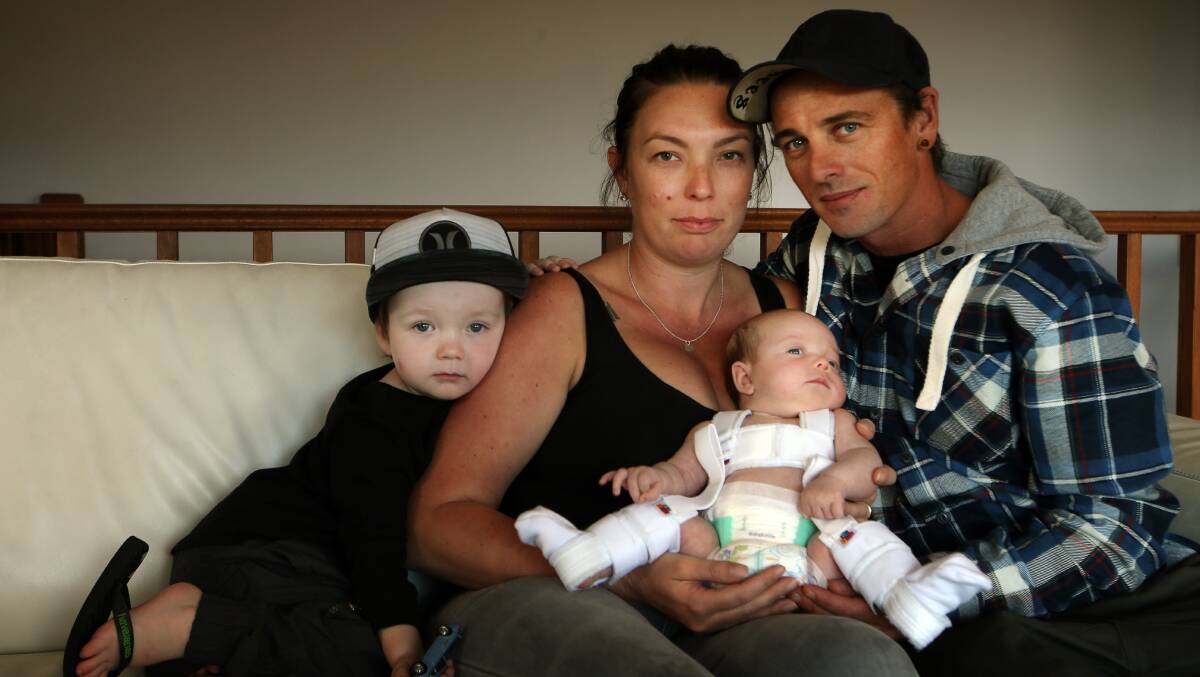 Braced for success: Albion Park parents Patricia and Daniel Thomas with their son Kade and seven-week-old daughter Eden who is being treated for hip dysplasia. Picture: Sylvia Liber