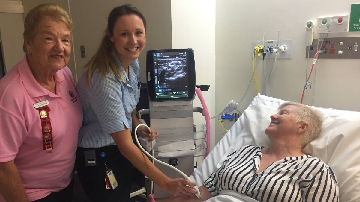 Easy access: Shellharbour Hospital Auxiliary president Lyn Thomson with clinical nurse consultant Amy Khan, testing the device on a colleague.