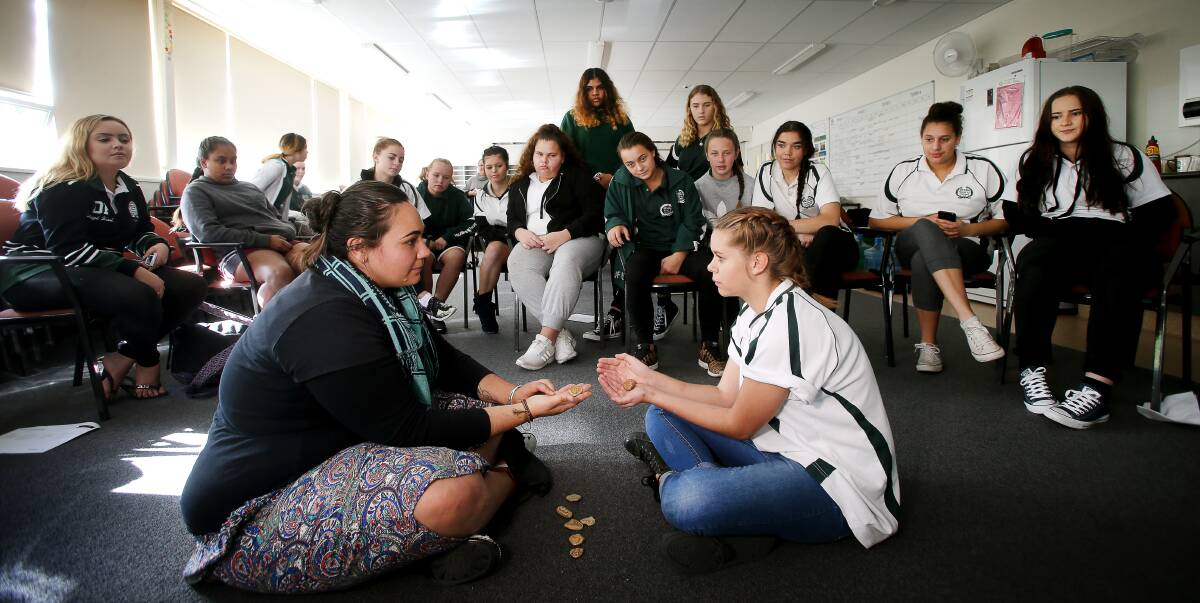 Building resilience: Aboriginal social worker Denika Thomas with Oak Flats High student Cinnamon-Lee McGregor and classmates at a Journey Stones session to put them in touch with their emotions. Picture: Sylvia Liber