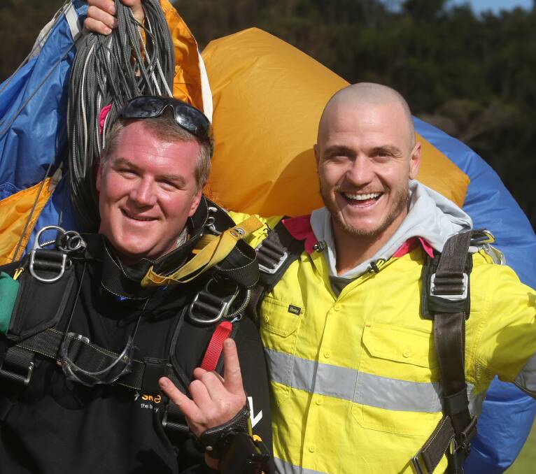 Smooth landing: Demmrich with tandem master Andre Hansen at Stuart Park after the jump. Picture: Robert Peet