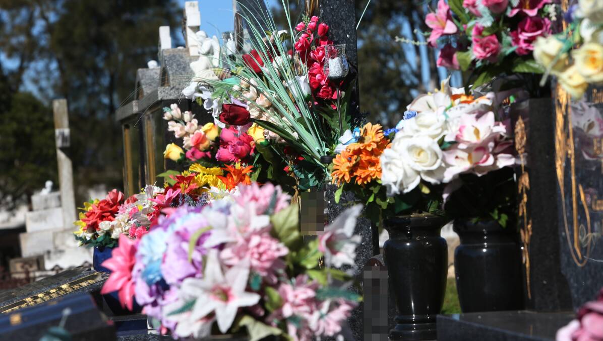 Fake or fresh flowers will need to be placed in approved, unbreakable containers at Shellharbour cemeteries under a new policy. Picture: Robert Peet