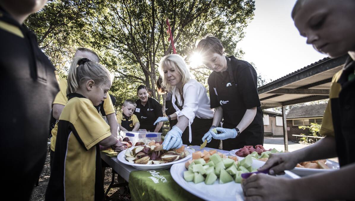 Better start: Associate Professor Karen Charlton (centre) with Annie McNamara and Annemiek Monteiro from All Sustainable Futures at the launch of a healthy food van at Albion Park Rail Public School. Picture: Paul Jones