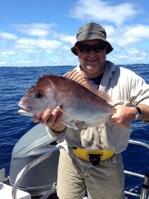 Big red: Steve Vekar managed to haul in this nice snapper before conditions deteriorated last weekend.