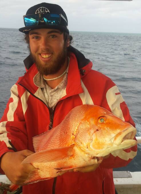 Jarrod Clarkson with a red emperor from a recent offshore trip up north.