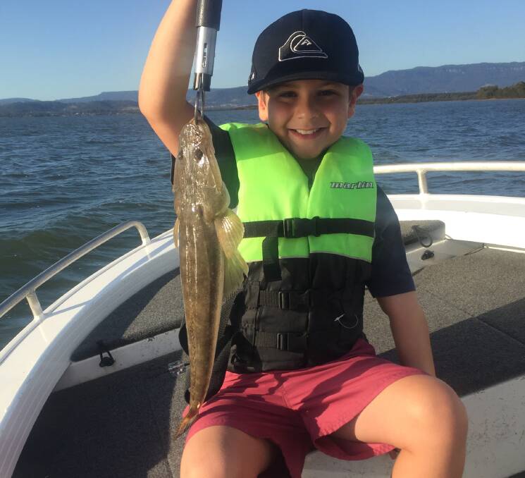 Levi-Rhy Bock with his 51cm flatty caught on a fishing clinic rod/reel outfit.