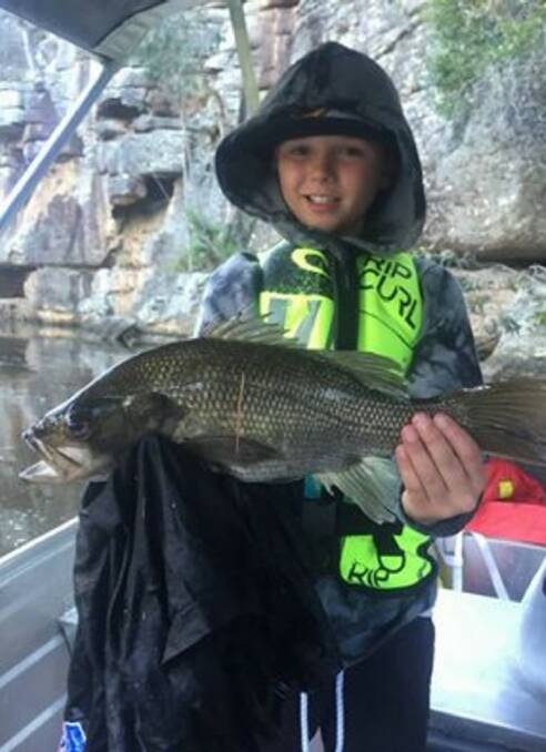 Good catch: Rixon Jarvis with a solid new season bass, just before release.