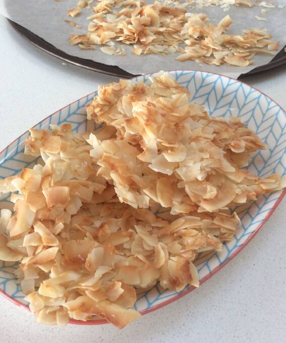 Tasty treat: A simple way to make flaked coconut taste even better is to lightly toast it covered with a trickle of rice malt syrup and then break it into shards to serve as a snack with your cuppa.