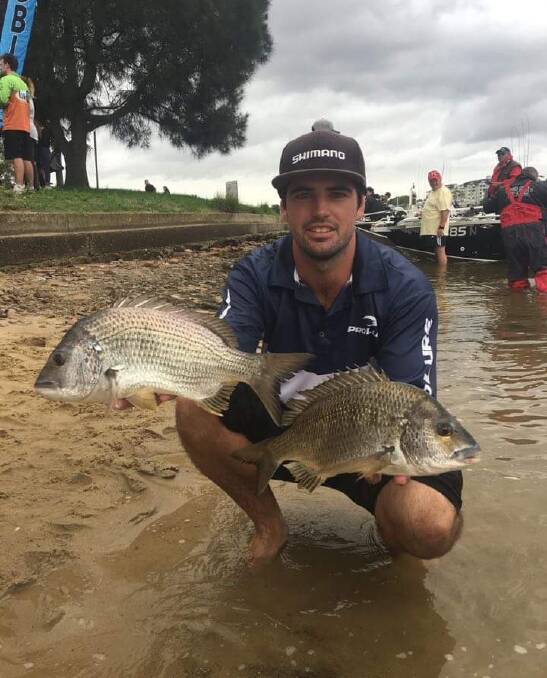Harbour haul: Callan Young with a couple of stud bream from Sydney Harbour last Sunday. Callan was competing in the Hobie Polarised Southern Bream series.