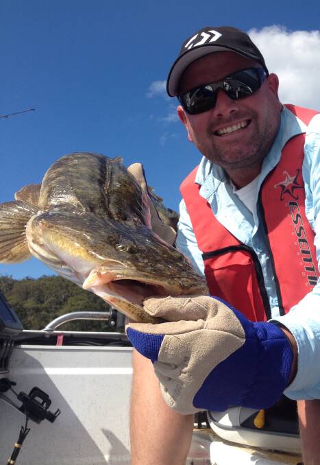 Smile for the camera: Craig Mclaughlin jigged a plastic last week to catch and release this 88cm flattie.