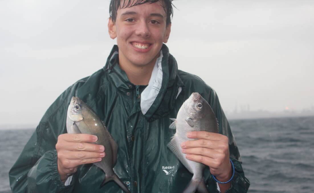 It beats school!: Dario Maffulo from Warrawong High with a pair of sweep he caught on a recent school fishing excursion.