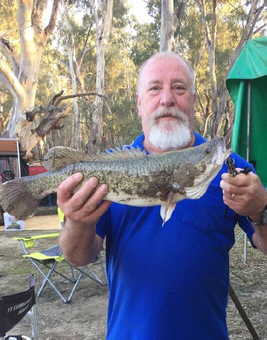 Laurie Owens and a 65cm cod caught in the Murrumbidgee River.