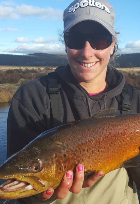 Braving the cold: Kimberley Stolk with a spawn run brown trout of 2.5 kilos she caught when it was minus 10 degrees at Eucumbene River last weekend