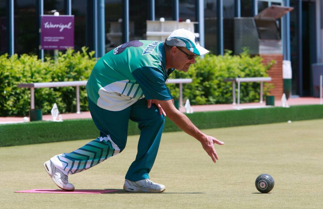 Champ: Warilla's Geoff Christie plays his bowl in his team's remarkable win in the Illawarra Zone 16 Fours Championship at Warilla Bowling Club. Picture: Georgia Matts