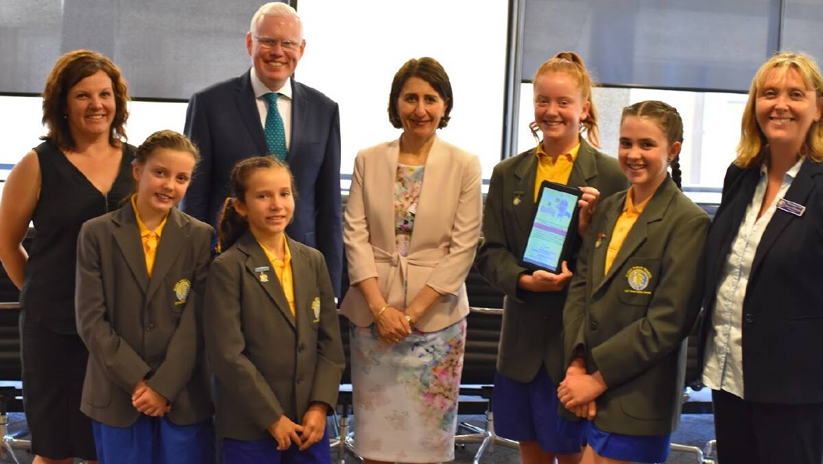 Parliamentary Secretary for Education Gareth Ward and NSW Premier Gladys Berejiklian with Kiama Public School students who have developed an anti-bullying app.
