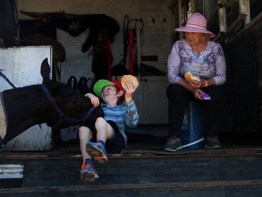 TIME FOR A BREAK: Jack Priestly and Diane Priestley having lunch in the back of their truck at the Albion Park Show on Saturday. Picture: Sylvia Liber