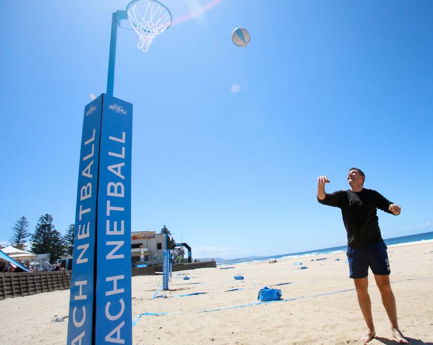 PRACTICE: Former North Melbourne AFL player Anthony Stevens gets in some practice before Saturday's celebrity Beach Netball match at North Wollongong Beach.