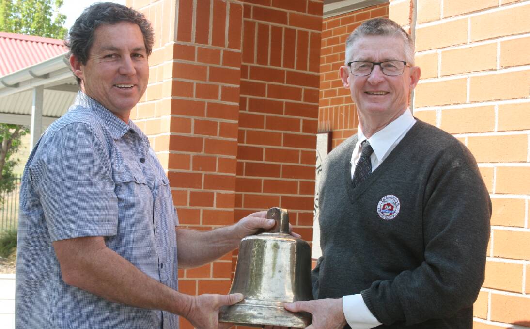BELL HUNT: Mark Thurston and Tullimbar Public School principal John Clune are on the hunt to find the original school bell before the school's 10th anniversary celebrations on November 3. 