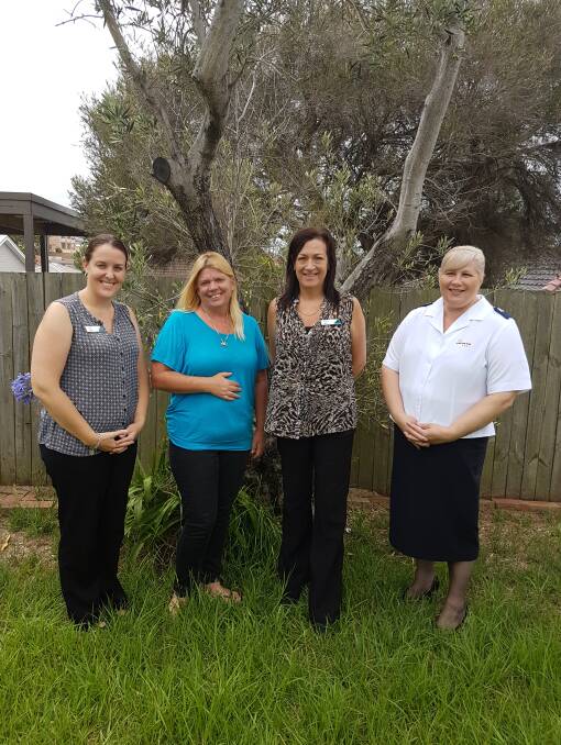 A PLACE TO CALL HOME: Leasha (blue top) with Housing Trust staff Heidi and Sue and Salvation Army's Karen Walker.