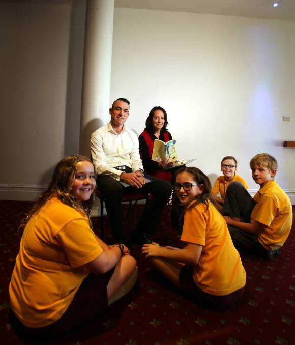 READING TIME:  Illawarra authors Sean Farrar and Sue Whiting read to Waniora Primary School students Marli Brodbeck, Chloe Rutherford, Thomas Wilkie and Dominic Gould. Picture: Sylvia Liber
