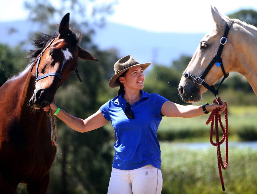 TWO BETTER THAN ONE: Leigh Nelson with her winning horses Vahlinvader and WIld Moors Pre Ordained. Picture: Sylvia Liber 
