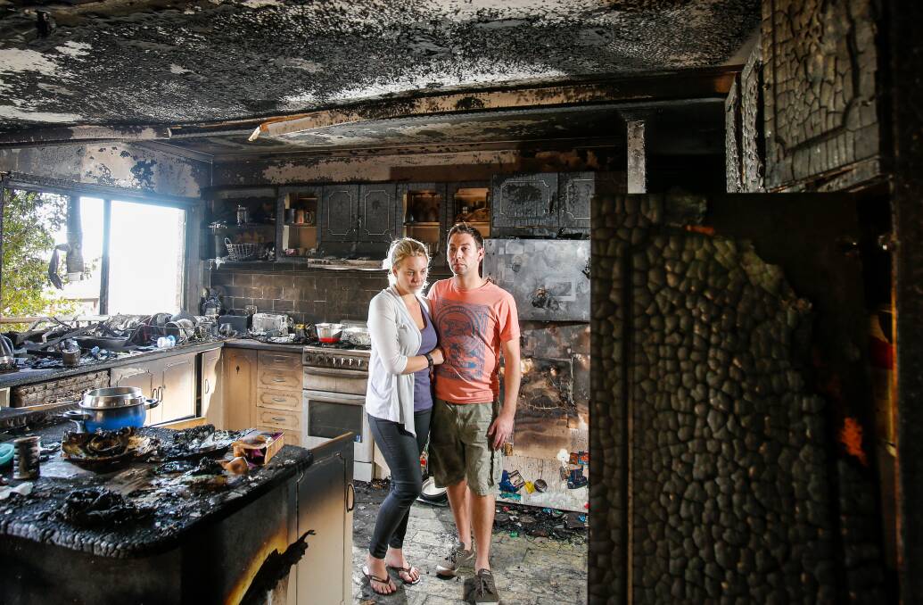 ﻿GUTTED: Unanderra firefighter John Balzan and wife Lani are facing an uncertain future after a fire that started outside ripped through their home. Picture: Adam McLean