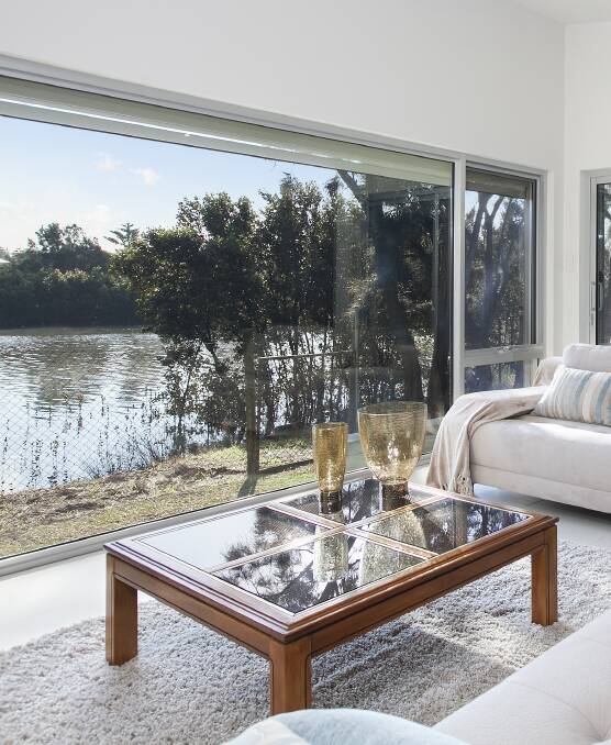 WATERFRONT: This architecturally designed home in Headland Parade, Barrack Point backs directly on to Little Lake and is close to beaches and the headland.