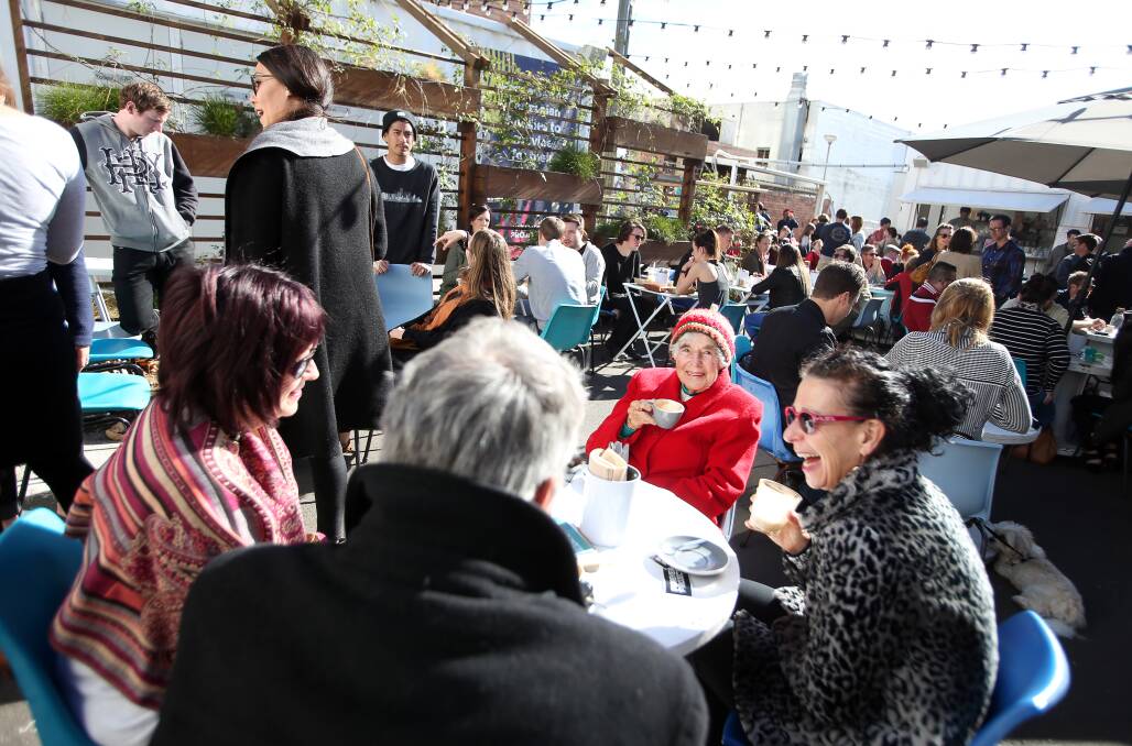 CAFE FUNDRAISER: A large crowd gathered at Sifter’s on Sunday to enjoy live street art, food and entertainment with half the funds from coffees sold on the day going to Forever Projects. Picture: Sylvia Liber