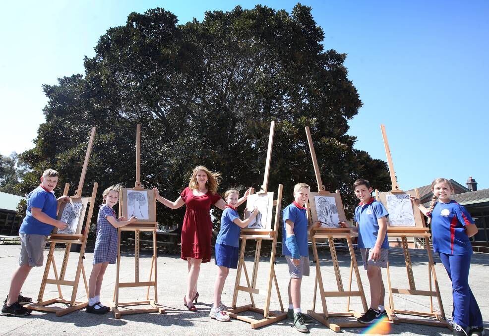 OUTDOOR ART: Shellharbour Public school teacher Jo Dyson with students Brayden Stewart, Keeley Miller, Ginger Cummins, Clay Marland, Curtis Whalan and Scarlett Hughes. Picture: Sylvia Liber 