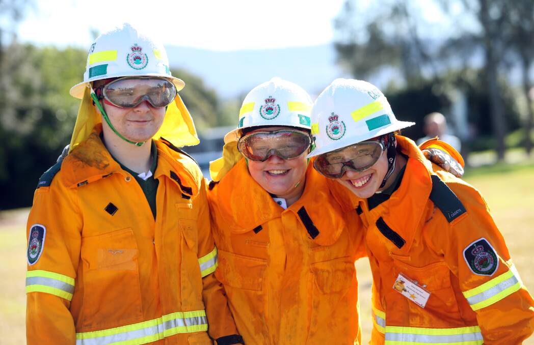 FIRED UP: Kanahooka High School support unit students Joel Psaila, Adrian Abrahams and Kane Van Hout are among 20 students who have graduated from the NSW  Rural Fire Service School Cadet Program. Picture: Sylvia Liber