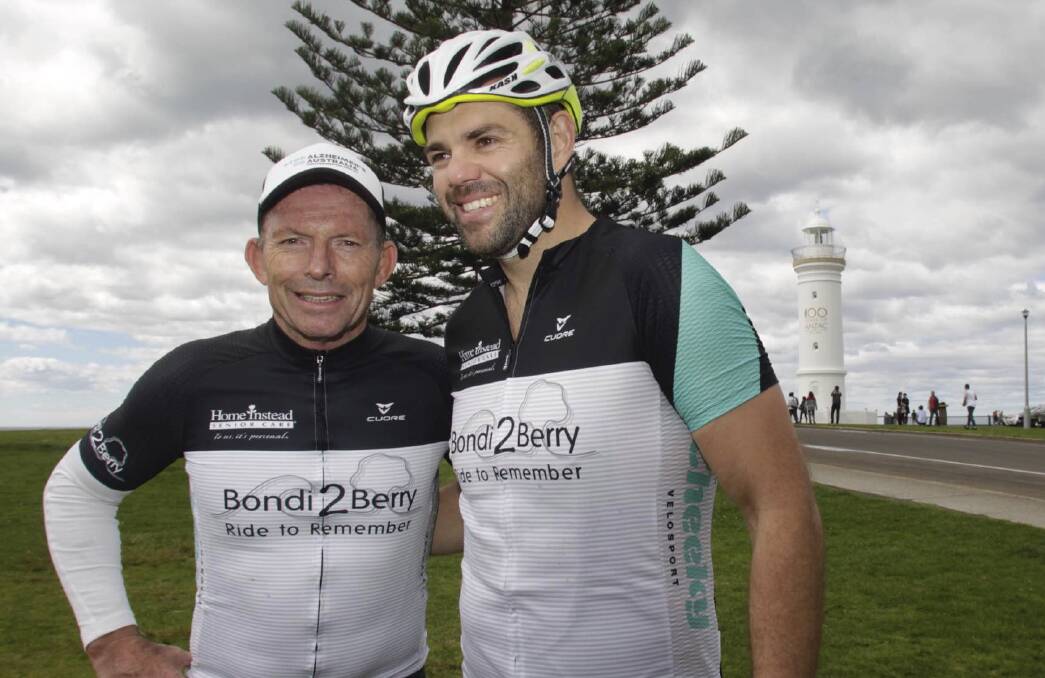 CHARITY RIDE: Former Prime Minister Tony Abbott with fellow cyclist Nick Young while in Kiama on Saturday. Picture: Georgia Matts 