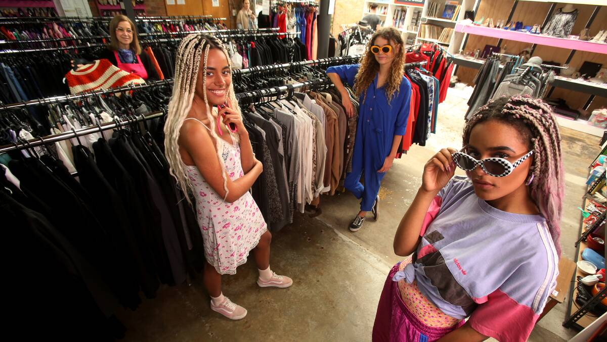 BARGAINS: Mission Australia Op Shop's Miriam Sanchez with models Anisha Okpalanze, Ruby Hough and Jenaya Okpalanze at their Corrimal store. Picture: Robert Peet