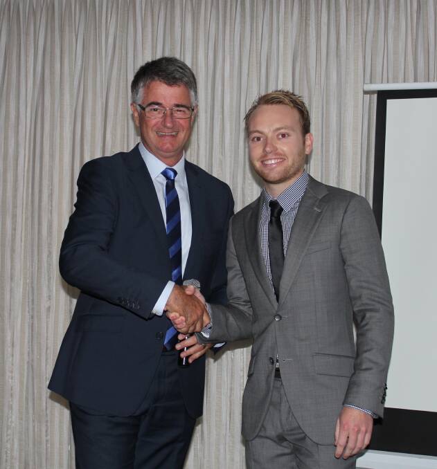 CONGRATULATIONS: Then REINSW president John Cunningham with last year's Illawarra competition winner Jake Mackenzie. 
