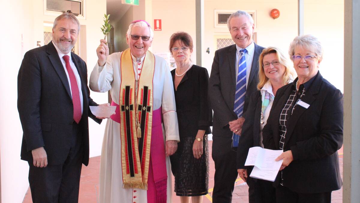 CEREMONY: Leo Tucker,  Bev Kerr, Denis Walsh, Julia Parkes and Gay Mason from St Vincent de Paul Society NSW with Bishop of Wollongong Peter Ingham at the official blessing and renaming of the service on Friday. Picture: Supplied