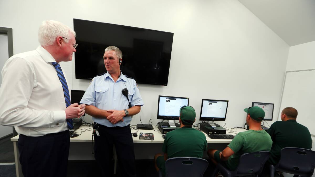 PREPARING: Parliamentary secretary for the Illawarra Gareth Ward and Mark Gallagher, senior overseer of community projects with inmates at the Illawarra Reintegration Centre on Monday. Picture: Sylvia Liber 