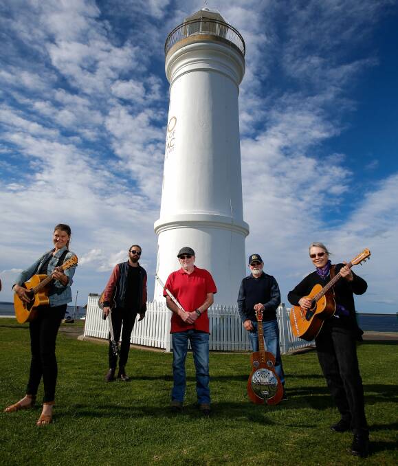 Penny Hartgerink, Joe Mungovan, John Spillane, Ray Marshall and Chris Wilson busy preparing for the Folk By The Sea festival at Kiama. Tickets at www.folkbythesea.com.au/tickets or 1300 887 034. Picture: Adam McLean 