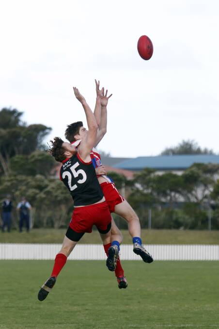Action photos from South Coast AFL grand final between Wollongong Bulldogs and Wollongong Lions

Pictures: Sylvia Liber