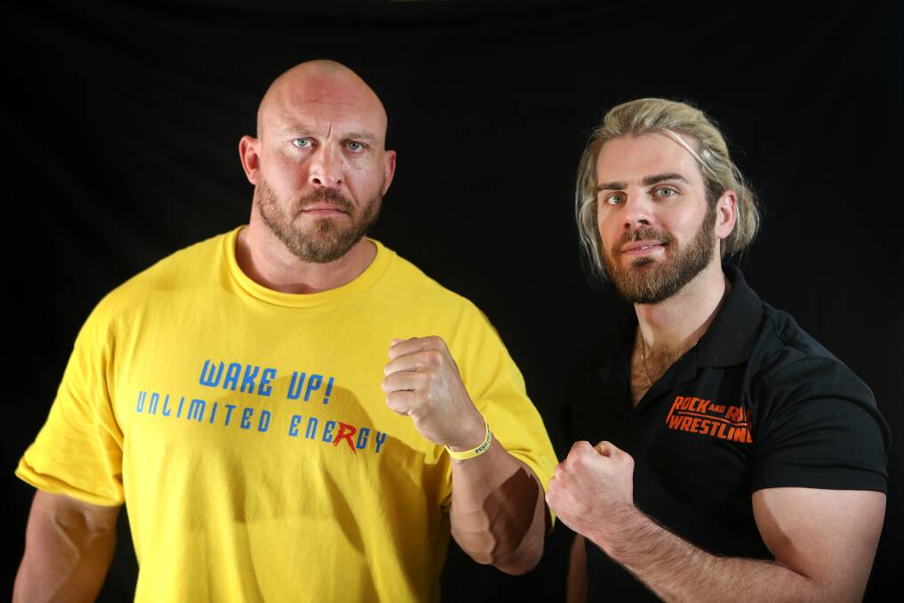 (Above) Potter with former WWE Superstar Ryback, during the latter's visit to Wollongong earlier this year. Picture: Sylvia Liber