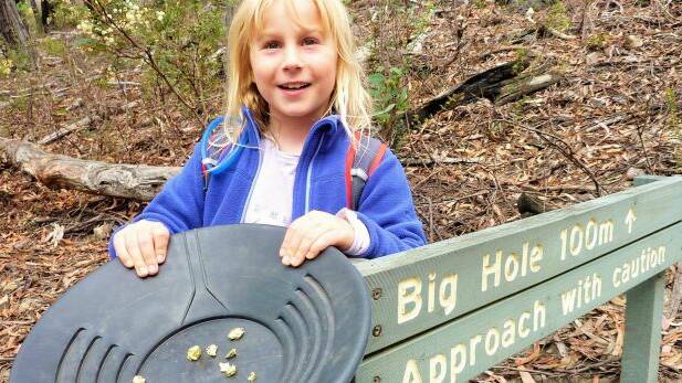 Sarah finds "gold" at the Big Hole. Photo: Tim the Yowie Man
