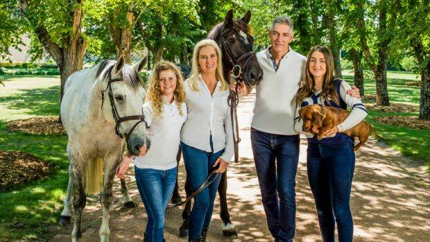 The Inglis family (from left), Alexandra, Charlotte, Arthur and Antoinette, with horses Billy the Kid (at left) and His Royal Emblem, and sausage dog Bilbo Baggins. Photo: Tim Bauer

