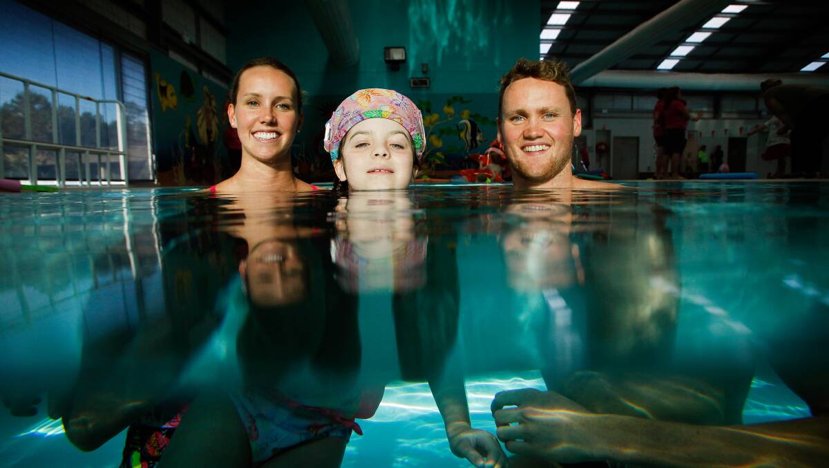 Home-grown Olympians, Emma and David McKeon with Chloe. 