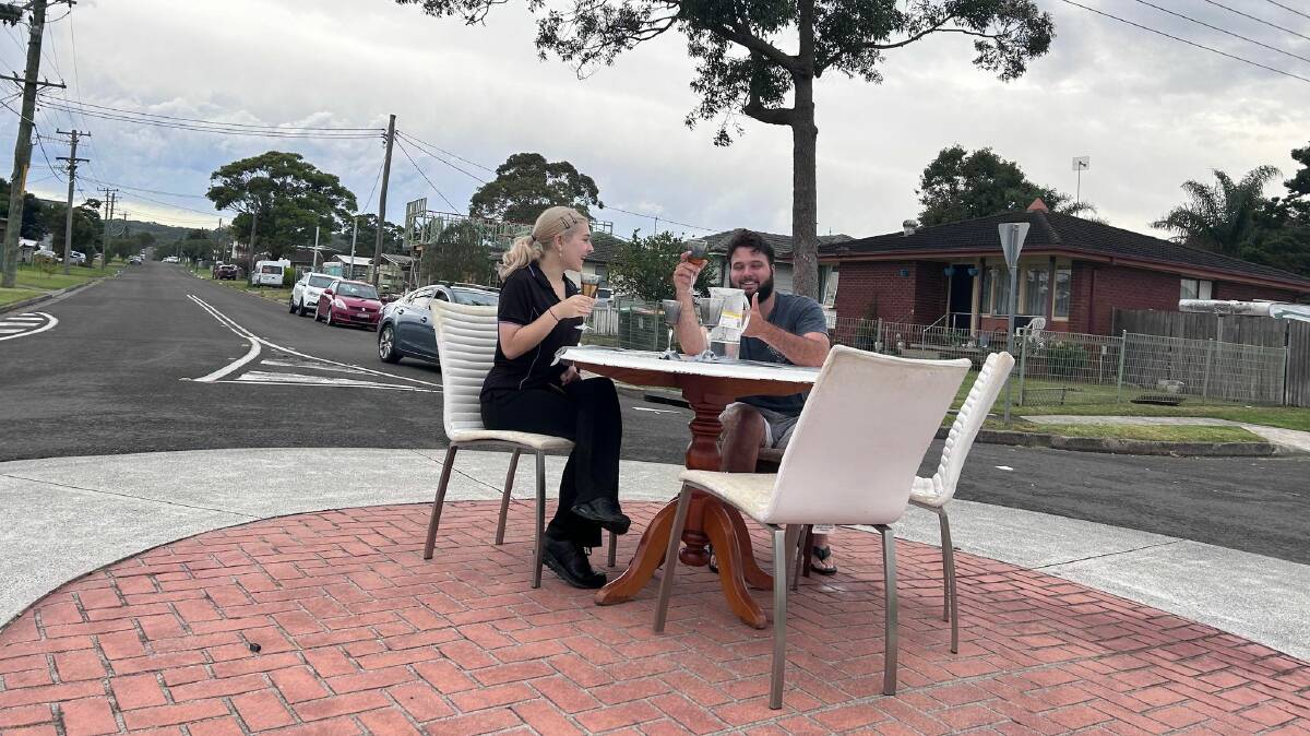 A couple stopped on the way home from work to enjoy a drink at the roundabout. Picture by Mary Jackson