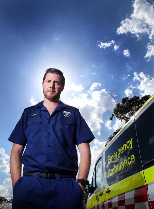Paramedic Trent McLennan says NSW Ambulance uniforms offer little protection against the heat. Pictures: Sylvia Liber